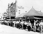 Men Waiting In Line For an Auction, 1912